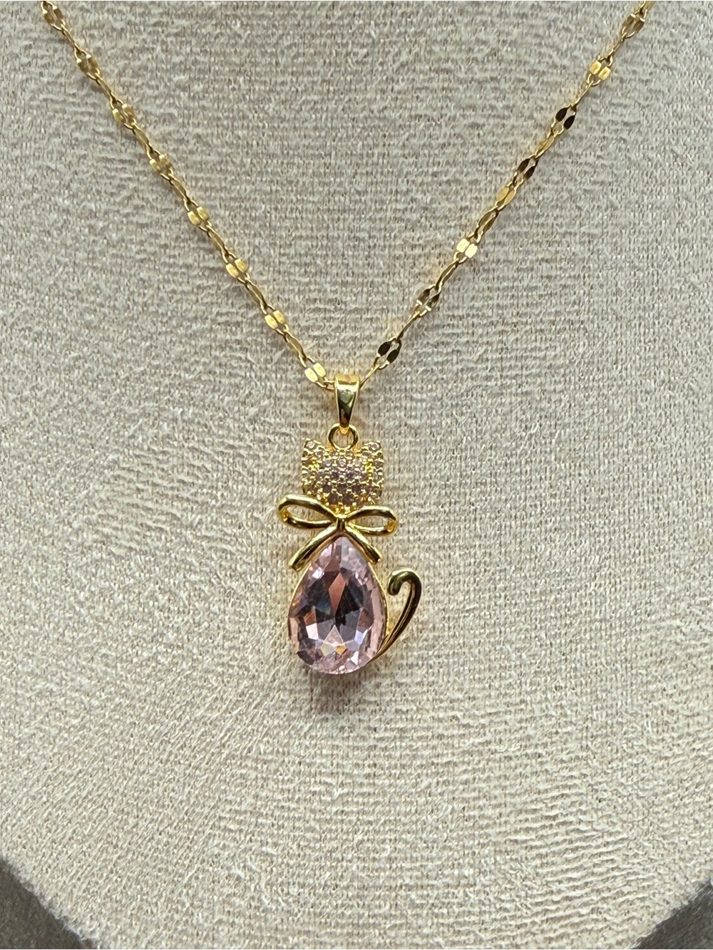 Stainless steel necklace with a pink crystal cat pendant and gold-tone finish